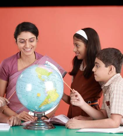 two students with a teacher